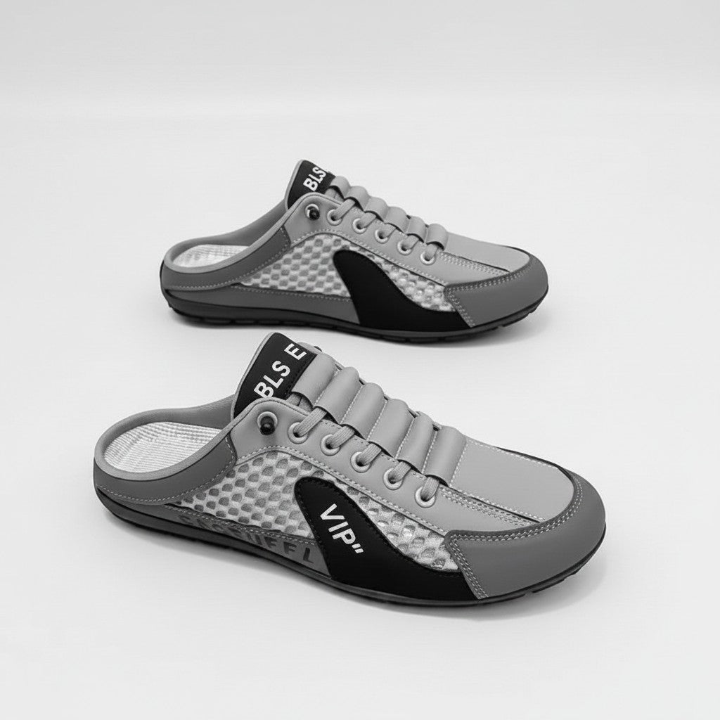 Mules sneakers Doglory gris et noir en similicuir avec empiècements en maille et détails embossés pour le confort.